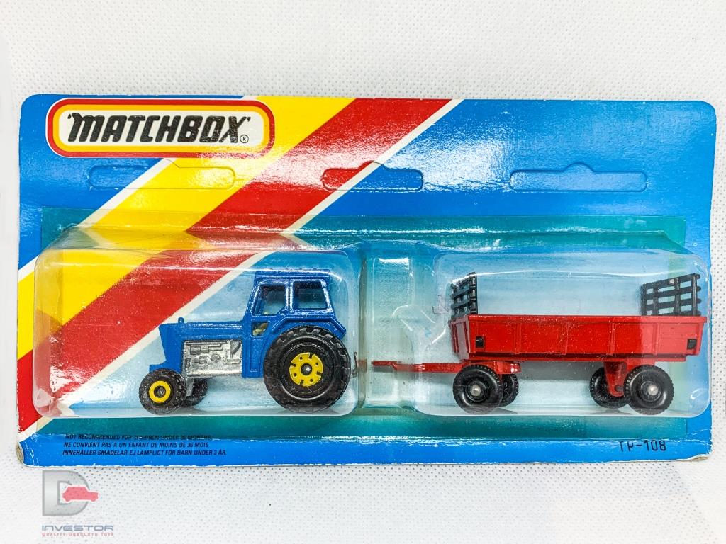 Matchbox Superfast Twin Pack containing No.46 Ford Tractor and No.40 Farm Hay Trailer TP108 containing blue tractor with yellow hubs and red trailer with black plastic wheels and black raves - all with Lesney England bases - contents Near Mint to Mint in Excellent blister pack, un-punched card.