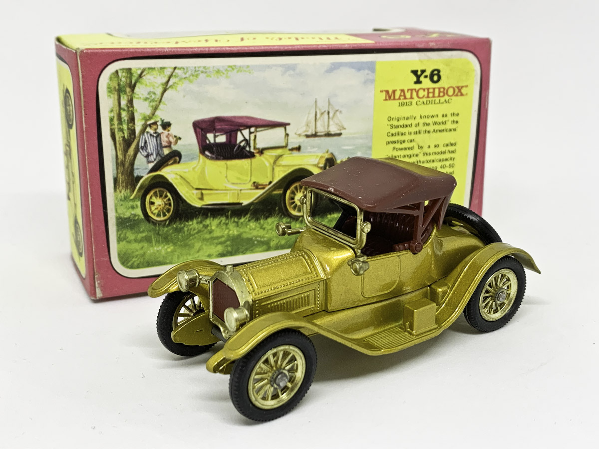 Matchbox Models of Yesteryear Y6 1913 Cadillac - Issue 10 - metallic light gold body & chassis, body with side cut-outs, maroon smooth roof with locating pins, windscreen with locating lug, maroon grille & seats, type C base with cast shut holes, small 11.5mm diameter brass 12-spoke wheels - Excellent Plus with a few tiny pin size chips in good plus type F pink/yellow window box, some fading and signs of wear.